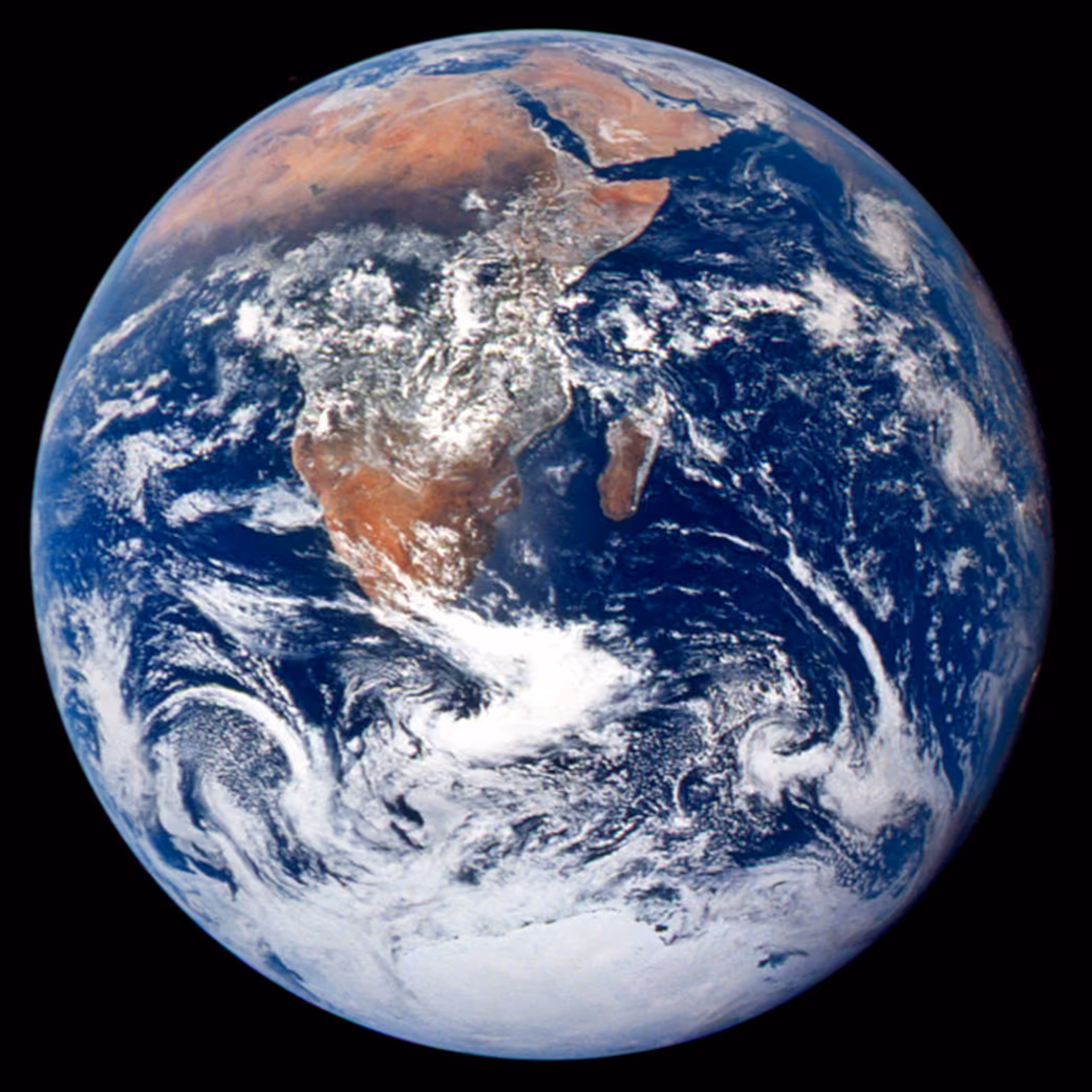 The whole Earth seen from Apollo 17 in December 1972, with Africa and Madagascar at the centre, deep blue ocean, swirling white cloud and the Antarctic ice cap at the bottom.
